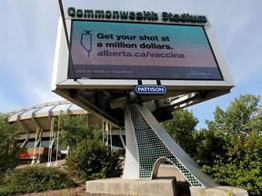 An advertisement promoting Alberta's COVID-19 vaccination lottery is visible on a digital billboard outside Commonwealth Stadium, in Edmonton Monday Aug. 30, 2021. On Monday the Edmonton Elks announced that proof of vaccination or a negative COVID-19 test will be required by fans to attend games as of Oct. 15.