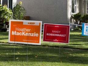 Edmonton Centre Federal election signs for the NDP's Heather MacKenzie and the Liberal's Randy Boissonnault are visible in front of homes, in Edmonton Monday Sept. 13, 2021. Photo by David Bloom