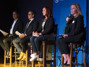Amarjeet Sohi, left, Michael Oshry, Cheryll Watson, and Kim Krushell take part in an Edmonton mayoral candidates forum at Polar Park Brewing on Wednesday, Sept. 8, 2021.