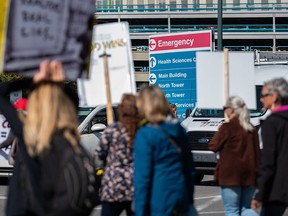 Protesters gather outside the Foothills Medical Centre in Calgary to protest vaccine mandates on Monday, Sept. 13, 2021.