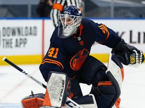 Edmonton Oilers goaltender Mike Smith (41) faces the Winnipeg Jets in Game 2 of their NHL North Division playoff series at Rogers Place in Edmonton on May 21, 2021.