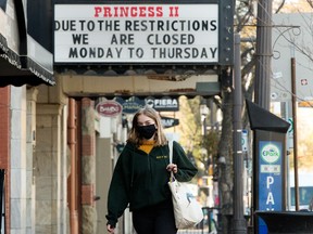 The marquee outside the Princess Theatre, 10337 82 Ave., advertises the theatre's reduced hours of operation due to COVID-19 restrictions, in Edmonton Thursday Oct. 7, 2021. Photo by David Bloom
