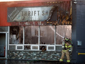 Firefighters battle a multi business fire near Coronet Road and 77 Street in Edmonton on Oct. 8, 2021.