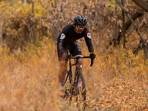 Mark Jung competes in the elite men’s event in Queen Elizabeth Park during the Alberta Cyclocross Collective’s Baby Walter Cross at Walterdale Bridge in Edmonton, on Sunday, Oct. 17, 2021. It’s the first sporting event to be held on the hill. Photo by Ian Kucerak