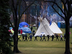 Protesters continue to inhabit a camp set up on the Alberta Legislature grounds, in Edmonton Saturday Oct. 23, 2021. Photo by David Bloom
