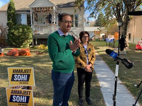 Edmonton mayoral candidate Amarjeet Sohi takes questions from media ahead of an afternoon of door-knocking in the community of Highlands on Saturday, Oct. 16.