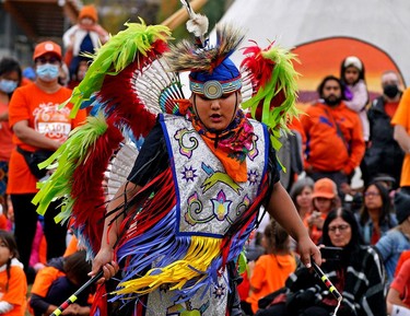 Courage Lachance (10) performs a dance at Kinsmen Park in Edmonton on Thursday September 30, 2021, where hundreds of people gathered to participate in the Orange Shirt Day Run-Walk, marking the first National Day for Truth and Reconciliation in Canada.