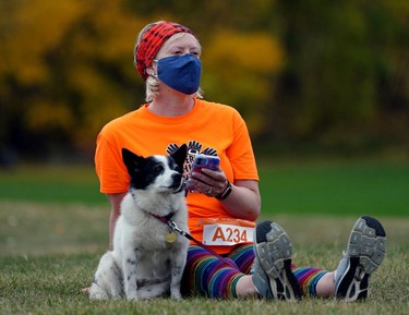 Christine Loo and her dog Olive joined hundreds of people who gathered at Kinsmen Park in Edmonton on Thursday September 30, 2021 to participate in the Orange Shirt Day Run-Walk, marking the first National Day for Truth and Reconciliation in Canada.