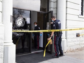 Police tape off a crime scene at LeMarchand Mansion on Wednesday, Oct. 6, 2021  in Edmonton.   A witness said there was a lot of blood just out side Kline Fine Jewellery & Design store.