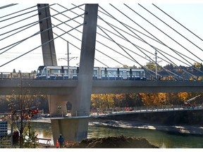 An LRT train crossed the Tawatinâ Bridge for the first time during testing phases which they will be conducting over the North Saskatchewan River in Edmonton, Tuesday, Oct. 12, 2021. The Valley Line Southeast LRT is delayed again until first quarter of 2022.