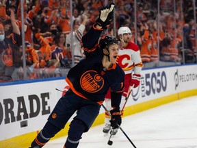 Edmonton Oilers' Jesse Puljujarvi (13) celebrates a goal on Calgary Flames goaltender Jacob Markstrom (25) during third period NHL action at Rogers Place in Edmonton, on Saturday, Oct. 16, 2021.