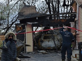 Fire investigates are on the scene of a early morning house fire at 3729 60 St. In Edmonton on Monday, Oct. 18, 2021.