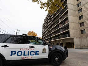 Edmonton Police Service officers investigate a suspicious death in the Burlington Arms tower apartment complex at 12841 65 St., on Monday, Oct. 18, 2021.