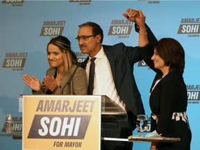 Amarjeet Sohi celebrates with his wife Sarbjeet (right) and daughter Seerat (left) at the Matrix Hotel in Edmonton on Monday October 18, 2021 after being elected Mayor of Edmonton.