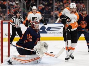 Edmonton Oilers' goaltender Mikko Koskinen (19) stops\ Philadelphia Flyers' Oscar Lindblom (23) during second period NHL action at Rogers Place in Edmonton, on Wednesday, Oct. 27, 2021. Photo by Ian Kucerak