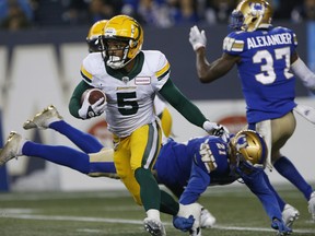 Edmonton Elks return man Terry Williams (5) carries the ball against the Winnipeg Blue Bombers in Winnipeg on Friday, Oct. 8, 2021.