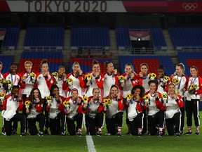 Women's soccer gold medallists Canada pose during the medal ceremony at the Tokyo 2020 Olympics August 6, 2021.
