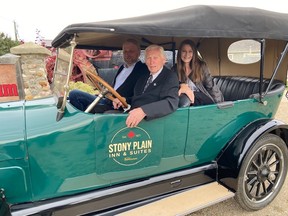 Gerry Levasseur, with son Gerard and daughter Lisa, at the wheel of the 1918 Willy Overland convertible his family last week presented to the Stony Plain and Parkland's Pioneer Museum.