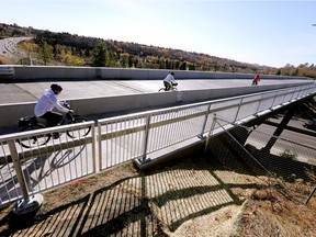 Cyclists make their way across the Ada Boulevard bridge in Edmonton on Oct. 12, 2021.