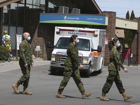 Members of the Canadian Armed Forces in front of Pickering's Orchard Villa long-term care home on Wednesday May 6, 2020.