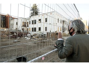 Keith McIntyre looks at the progress demolition crews have made at the El-Mirador apartments, 10147 108 St., in Edmonton on Wednesday. Oct. 20, 2021. McIntyre had lived in the El-Mirador for 20 years.