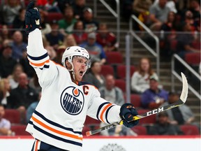 Edmonton Oilers center Connor McDavid (97) celebrates his goal against the Arizona Coyotes at Gila River Arena on Oct 21, 2021.