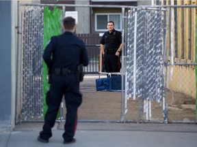 Edmonton police at the scene of a shooting near 94 Street and 111 Avenue on Thursday, Oct. 21, 2021.