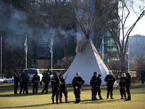 While most of the camp protesting COVID-19 vaccinations, Indigenous injustices have been removed from Alberta legislature grounds a few teepees remain with a large police presence staying close by on Monday, Oct. 25, 2021 in Edmonton .     Greg Southam-Postmedia
