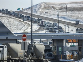 File photo: Road that runs along the international border between Montana and Alberta. Sweetgrass, Montana, USA on the left and Coutts, Alberta, Canada on Friday March 20, 2020.