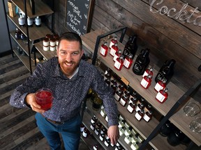 The Fort Distillery owner Nathan Flim with product from his new ready-to-drink cocktail company, Tumbler & Rocks.