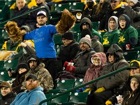 Edmonton Elks fans dance in the stands as the team plays the Hamilton Tiger-Cats during second half CFL action at Commonwealth Stadium in Edmonton, on Friday, Oct. 29, 2021.