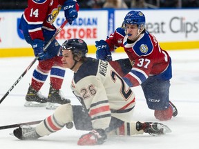 Edmonton Oil Kings’ Eric Johnston (37) has a shot blocked by Lethbridge Hurricanes’ Chase Wheatcroft (26) during first period WHL action at Rogers Place in Edmonton, on Tuesday, Nov. 2, 2021.