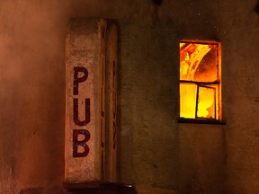 Edmonton Fire Rescue Service firefighters battle a blaze in the Milla Pub on 101 Street and 106 Avenue in Edmonton, on Tuesday, Nov. 2, 2021. Photo by Ian Kucerak