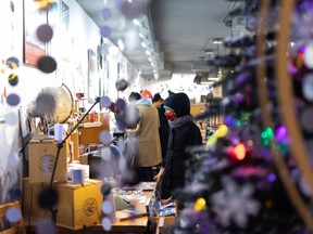 Visitors shop The Prints & The Paper gift shop during the All is Bright Festival on 124 Street in Edmonton, on Saturday, Nov. 20, 2021. Photo by Ian Kucerak