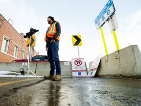 Frozen roadway is visible in the foreground as Andrew Grant, General Supervisor of Infrastructure Operations for the City of Edmonton, provides information on the first Phase 2 citywide parking ban of the season, during a press conference in Edmonton Monday Nov. 29, 2021. The Phase 2 parking ban begins Tuesday, November 30. Photo by David Bloom