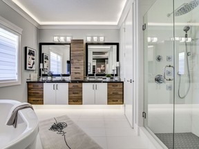 This ensuite by Concept Homes in Greisbach includes a multi-head shower, soaker tub and a dual vanity with tower storage to help keep counters clear.