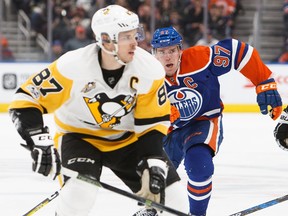 Connor McDavid (97) of the Edmonton Oilers pursues Sidney Crosby (87) of the Pittsburgh Penguins on March 10, 2017, at Rogers Place in Edmonton.