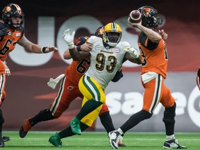 Edmonton Elks defensive end Kwaku Boateng (93) chases after B.C. Lions quarterback Michael Reilly in Vancouver in this file photo from July 11, 2019.