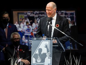 Former Edmonton Oilers defenceman Kevin Lowe speaks as his Number 4 jersey is retired during a ceremony on the ice at Rogers Place in Edmonton, on Friday, Nov. 5, 2021.
