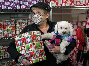 Carol Daneluk and her Mexican rescue dog Chica got an early start to Christmas shopping at the MADE for PETS market on Sunday November 14, 2021. The market was held at the Edmonton Humane Society and included twenty local vendors, artisans and crafters selling items for pets and their humans.