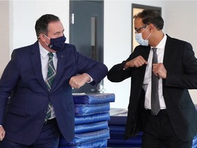 Alberta Premier Jason Kenney, left, greets Edmonton Mayor Amarjeet Sohi at the Herb Jamieson Centre.