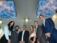 Members of Edmonton’s Commercial Real Estate Development Association – or NAIOP – stand in the lobby of the redeveloped HSBC building, on Tuesday, Nov. 23, 2021.