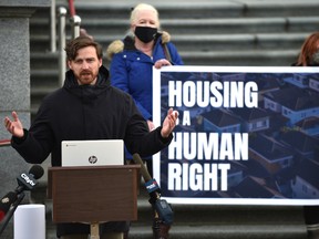 Bradley Lafortune, executive director of Public Interest Alberta, speaks outside the Alberta Legislature as housing rights advocates launched a province-wide housing campaign and call for the “eviction” of the provincial government for their affordable housing strategy, Monday, Nov. 22, 2021.