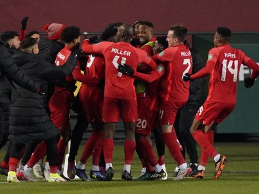 Team Canada celebrates after Jonathan David (20) scored the only goal of the game against Team Costa Rica during a FIFA 2022 World Cup qualifier soccer match held at Commonwealth Stadium in Edmonton, Canada on Friday November 12, 2021. Team Canada won the game 1-0. (PHOTO BY LARRY WONG/POSTMEDIA)