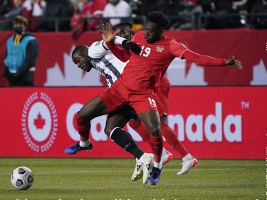 Team Canada's Alphonso Davies (right) and Team Costa Rica's Joel Campbell battle for the ball during a FIFA 2022 World Cup qualifier soccer match held at Commonwealth Stadium in Edmonton, Canada on Friday November 12, 2021. (PHOTO BY LARRY WONG/POSTMEDIA)