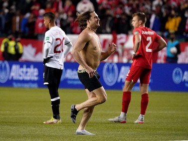 A man runs on the field near the end of the game between Team Canada and Team Costa Rica during a FIFA 2022 World Cup qualifier soccer match held at Commonwealth Stadium in Edmonton, Canada on Friday November 12, 2021. Canada defeated Costa Rica 1-0. (PHOTO BY LARRY WONG/POSTMEDIA)