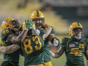 Edmonton Elks' Jalen Tolliver (88), Danny Vandervoort (83), David Beard (57) and Walter Fletcher (25) celebrate Vandervoort’s touchdown during second half CFL action in Edmonton on Friday, November 5, 2021.