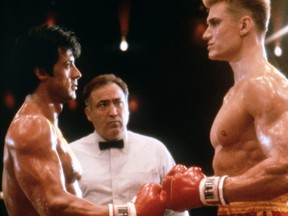 Actor, director and screenwriter Sylvester Stallone on the set of his movie Rocky IV, with Swedish actor Dolph Lundgren.