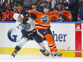 Leon Draisaitl overpowers yet another opponent, this time Seattle Kraken's Jeremy Lauzon.