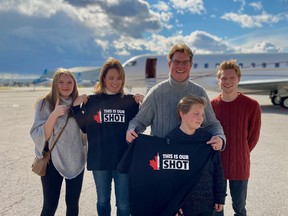 Julianne Powell, left, Melanie Powell, Jeremy Powell, Austin Powell and Zacahary Pennett stand in front of the private jet on which they enjoyed a free trip around southern Ontario on Friday, Nov. 12, 2021, part of their COVID-19 vaccine prize from the This is Our Shot campaign.